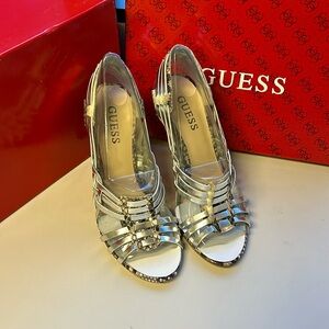 Guess open toe shoe/sandal with 4 inch heel.